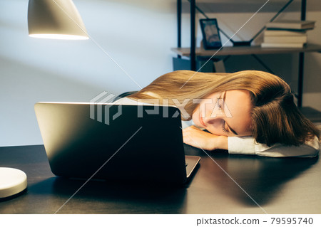 workaholic remote job tired sleeping woman office 79595740