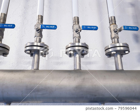 Metal chrome pipe with flange and set of valves. Industrial concept Metal chrome pipe with flange and set of valves. Industrial concept 79596044