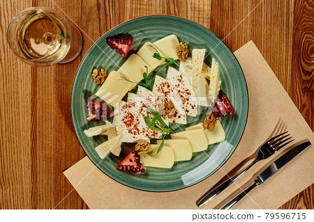 Platter of Georgian cheeses with spicy oil, pomegranate, walnuts Platter of Georgian cheeses with spicy oil, pomegranate, walnuts 79596715