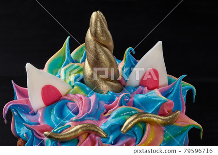 Details from pastry mastic on colorful whipped egg whites on Easter cake Details from pastry mastic on colorful whipped egg whites on Easter cake 79596716