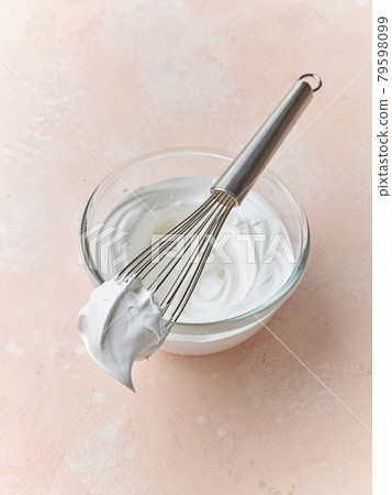 bowl of beaten egg whites 79598099