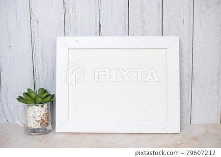 Picture frame mockup on wooden wall Picture frame mockup on wooden wall 79607212