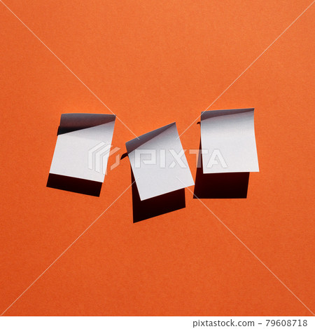 Blue sticky note paper on red background. copy space 79608718