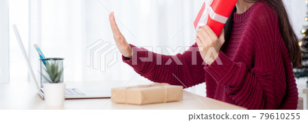 Young asian woman selfie video call online with friends and show red gift box in Christmas day. 79610255