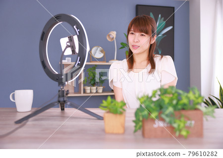 _ Videophone with LED ring light _ Woman sympathizing with a friend's sad story 1 _ Videophone with LED ring light _ Woman sympathizing with a friend's sad story 1 79610282