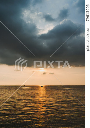 Small fishing hut in the middle of sunset and the sea. 79613903