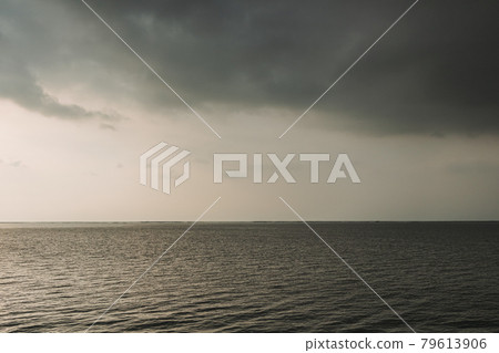 Sunset ocean with stormy cloud in the sky. 79613906