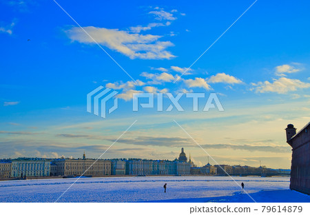 The Neva river in ice. Embankment of St. Petersburg with colorful neat buildings. The Neva river in ice. Embankment of St. Petersburg with colorful neat buildings. 79614879