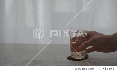 take rose drink into tumbler glass on white table 79615361