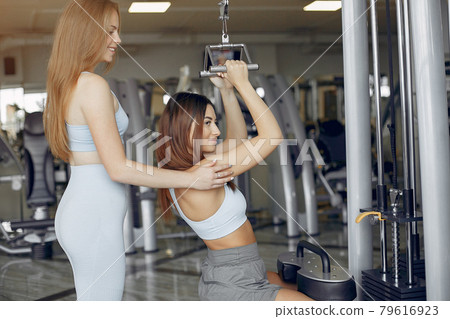 Sports girls training in a morning gym Sports girls training in a morning gym 79616923