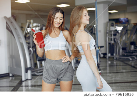 Sports girls training in a morning gym Sports girls training in a morning gym 79616936