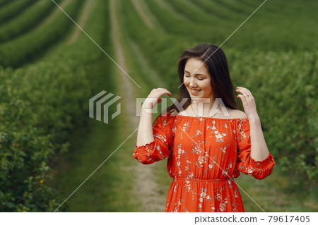 Elegant and stylish girl in a summer field 79617405