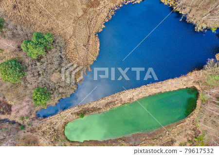 Aerial view of a lake in the German heath landscape, Vertical from great height 79617532