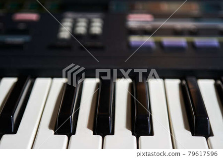 Keyboard of an electric piano, control unit out of focus in the background Keyboard of an electric piano, control unit out of focus in the background 79617596