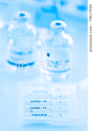 Bottle of COVOD-19 vaccine sample in a laboratory. Idea for researching and lab tests for coronavirus curing. 79617696