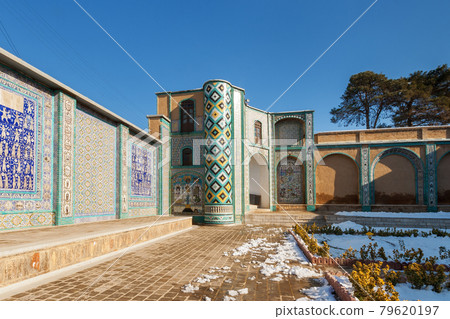 The courtyard of Tekyeh Moaven al-molk, historical place in Kermanshah.  Ceramic tiling with the images from the history of islamic era. 79620197