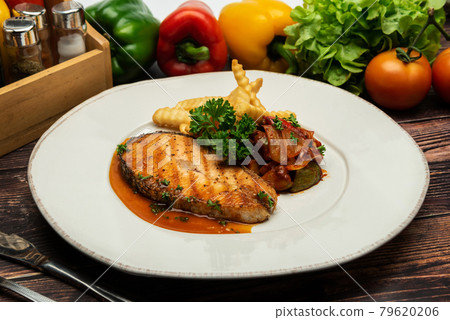 Grilled salmon with lemon and potato on wooden Grilled salmon with lemon and potato on wooden 79620206