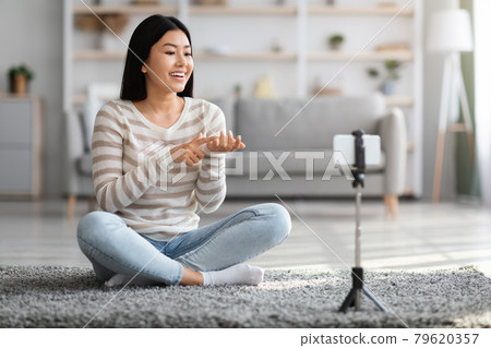 Video Blog. Smiling Asian Blogger Lady Recording Vlog At Home 79620357