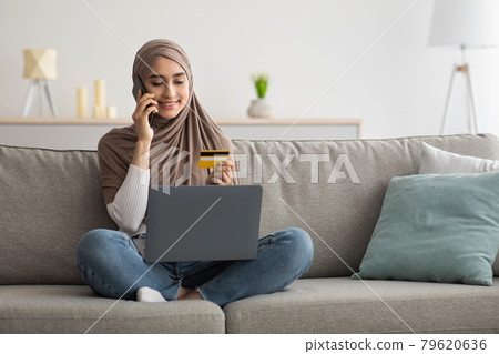 Online payment at home. Successful woman doing online shopping using computer 79620636