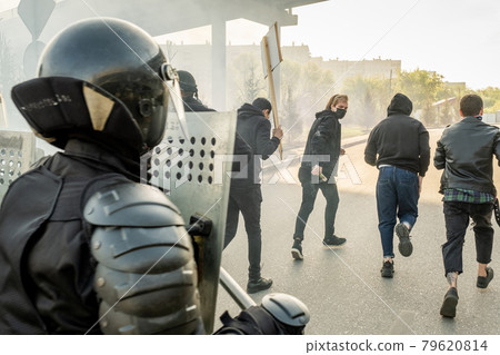 Police forces stopping hooligans 79620814