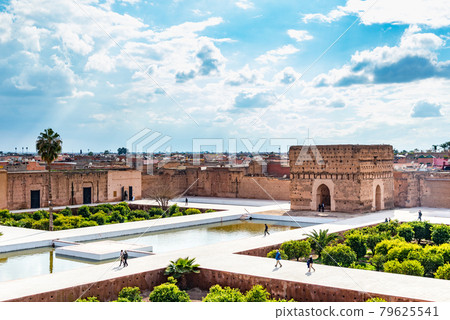 Tourist walking at El Badi Palace in Morocco Tourist walking at El Badi Palace in Morocco 79625541