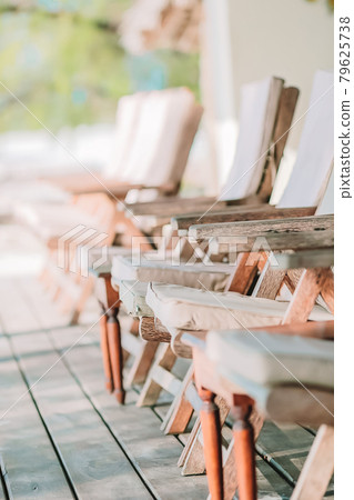 Summer empty outdoor cafe at exotic island on the seashore Summer empty outdoor cafe at exotic island on the seashore 79625738