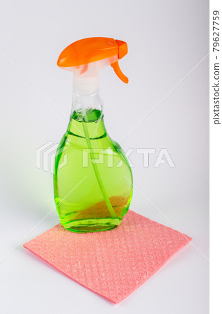 Spray Bottle and cleaning cloth on white background. Spray Bottle and cleaning cloth on white background. 79627759