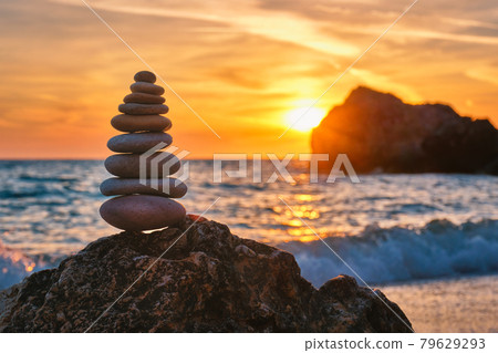 Concept of balance and harmony - stone stack on the beach Concept of balance and harmony - stone stack on the beach 79629293