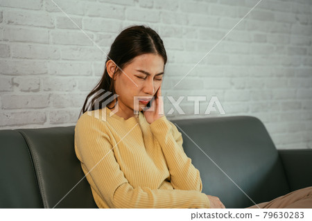 Woman suffering from toothache Woman suffering from toothache 79630283