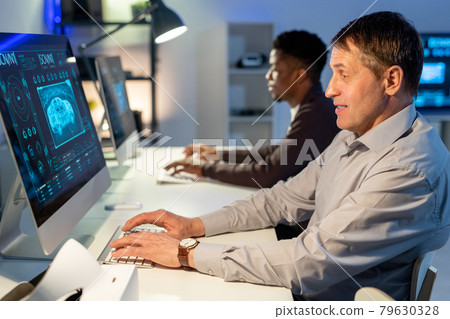 Mature Man Designing Car on Computer 79630328
