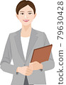 Woman working in a gray suit 79630428