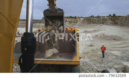Excavator digging stone on quarry Excavator digging stone on quarry 79632089