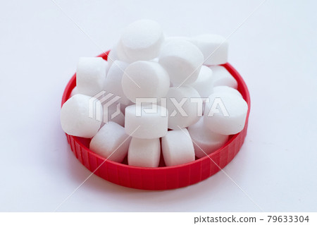 Naphthalene mothballs on white backgrond. 79633304