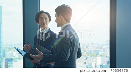 Businessman talking in the office 79634876