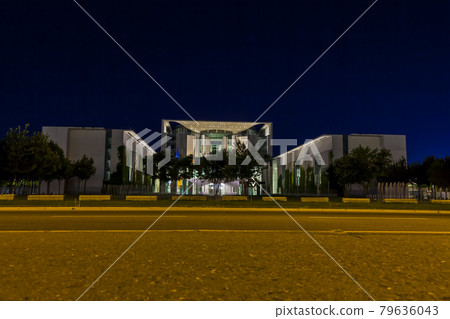 View on illuminated chancellery in Berlin at night from ground perspective 79636043