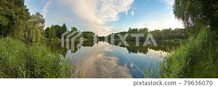 Peaceful scene from lovely small lake near Frankfurt in twillight Peaceful scene from lovely small lake near Frankfurt in twillight 79636070