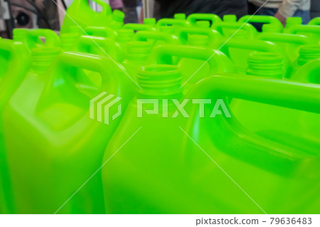 Many empty green plastic jerrycans Many empty green plastic jerrycans 79636483