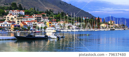 Greece, Ionian Island Kefalonia (Cefalonia). picturesque village Agia Efimia with sail boats over sunset.  79637480