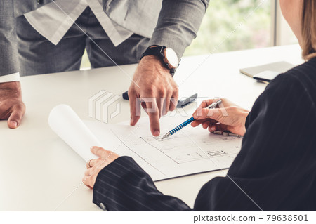 Architect and engineer working with drawing. Architect and engineer working with drawing. 79638501