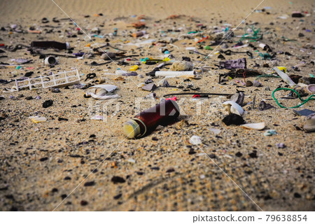 Plastic trash spreading on the beach 79638854