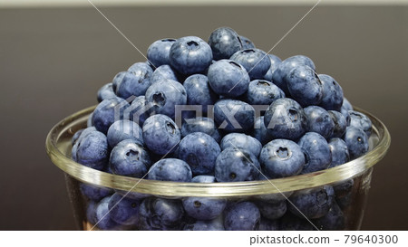 Heaps of blueberries in a glass bowl 4722 79640300