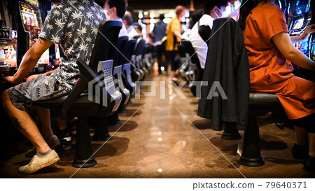 People playing pachinko and pachislot People playing pachinko and pachislot 79640371