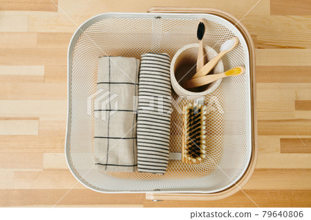 View of basket with bodycare items on wooden table View of basket with bodycare items on wooden table 79640806