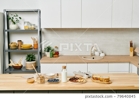Some organic food on wooden kitchen table 79640845