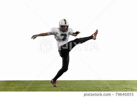 American football player posing with ball on black background Stock Photo  by master1305