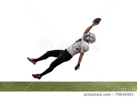 Portrait of American football player catching ball in jump isolated on white studio background. Portrait of American football player catching ball in jump isolated on white studio background. 79640901