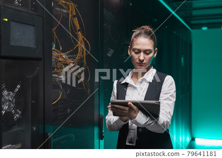 Young Woman in Server Room Young Woman in Server Room 79641181