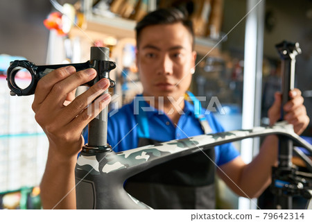Mechanic Fixing Handlebar Stem Mechanic Fixing Handlebar Stem 79642314