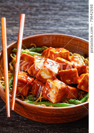 asian noodle bowl with hoisin baked tofu cubes 79642698