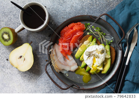 Valentine's day breakfast. Boiled egg sandwich with avocado, coffee, salmon and smoked salmon on a stone concrete tabletop. Top view flat lay background. 79642833
